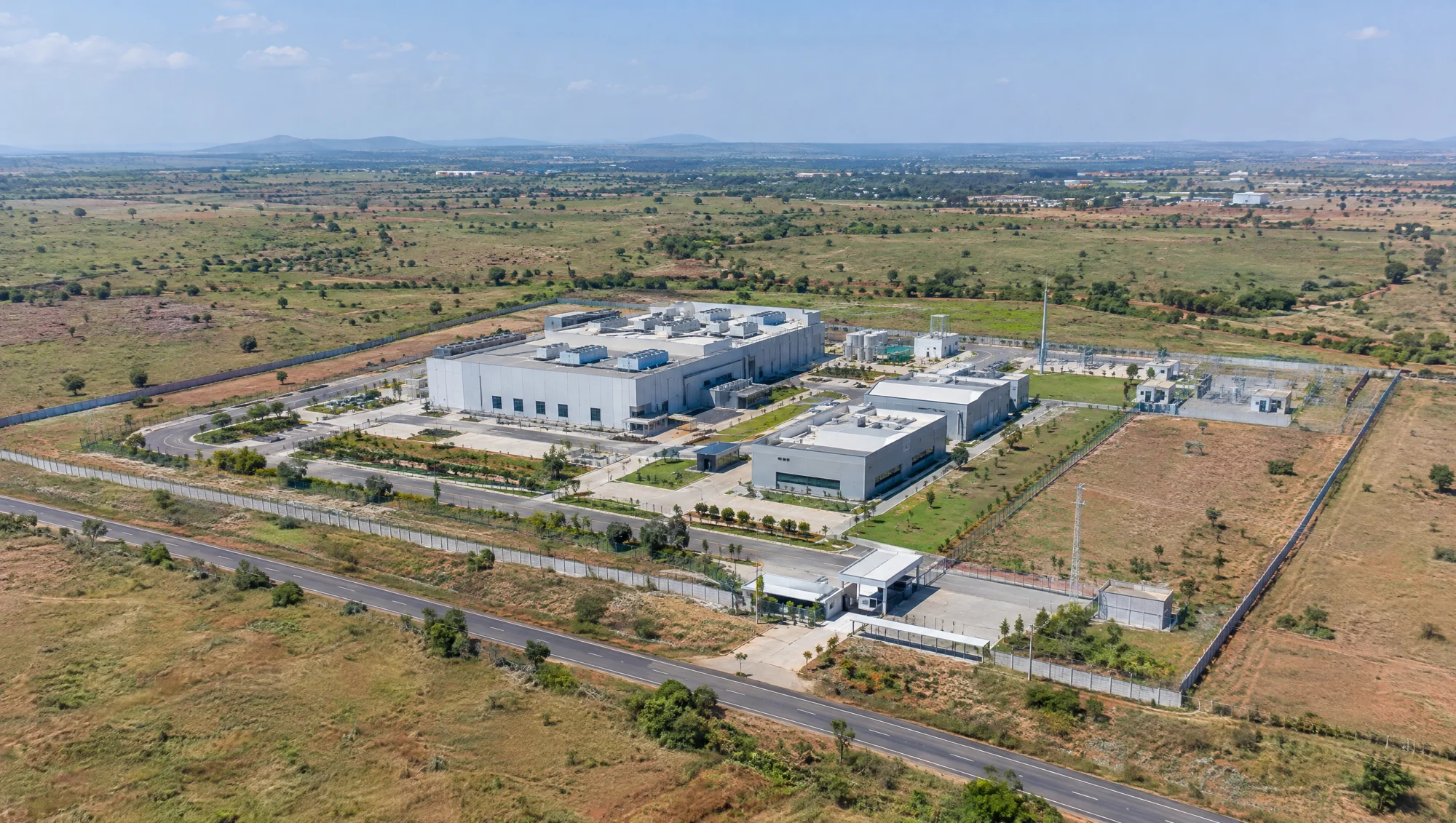 Concept view of a data-centre campus surrounded by open land and access roads